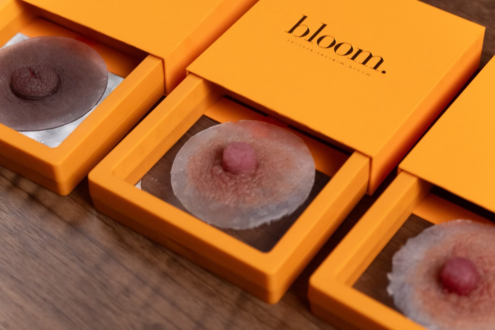 Three handmade Bloom pieces in different shades, each in the open drawer of its marigold box.